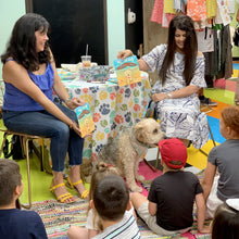 Load image into Gallery viewer, The canine star made a real-life appearance at Sweet Surrender, a popular Bakersfield bakery and gift shop. It’s also the location of our “Pismo or Bust!” opening scene, where Indy and Ben are making their coastal adventure plans! Kids love to see the real Indy in action!